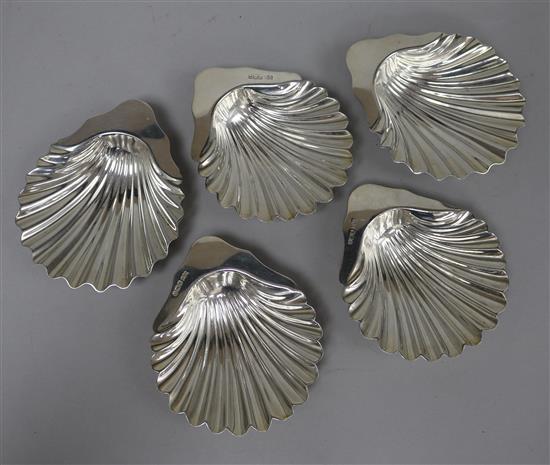 A pair of Victorian silver butter shells, London, 1886, 12cm and a later set of three silver butter shells. 11.5 oz.
